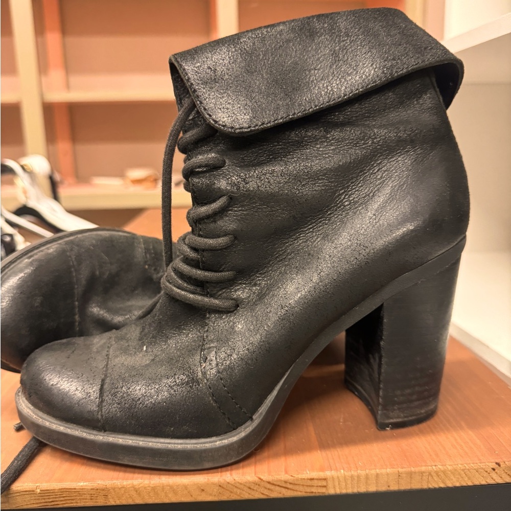Heeled black leather vintage boots